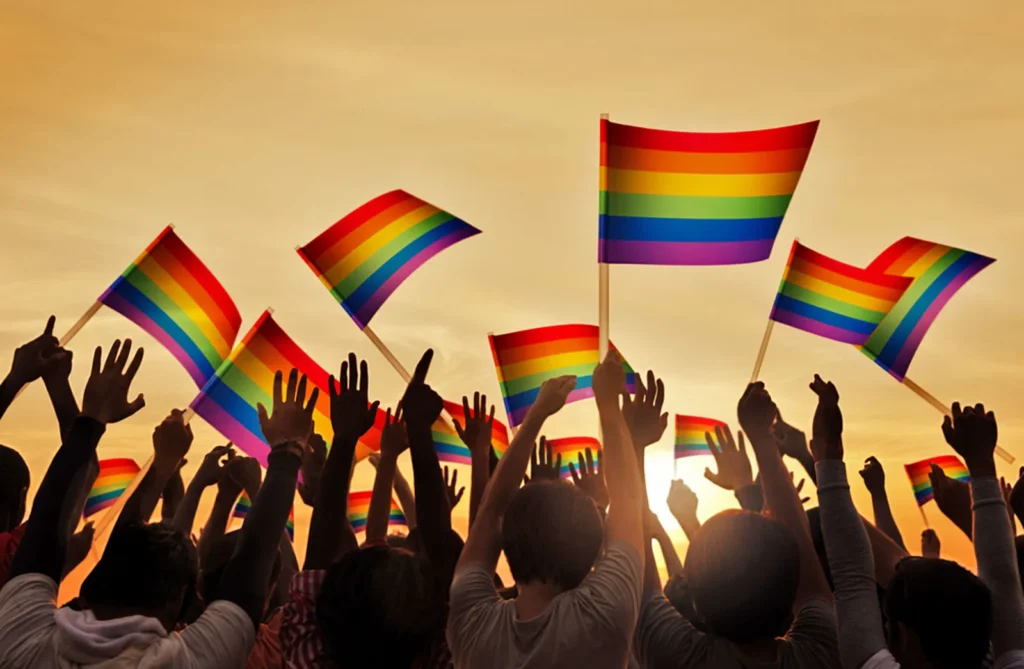 Silhouettes People Holding Gay Pride Symbol Flag band fm conquista